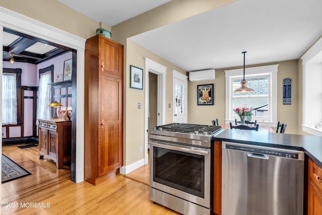 89 Heck Ave, Ocean Grove, NJ 07756 - kitchen with appliances with stainless steel finishes, a wall unit AC, dark countertops, brown cabinets, and light wood-type flooring