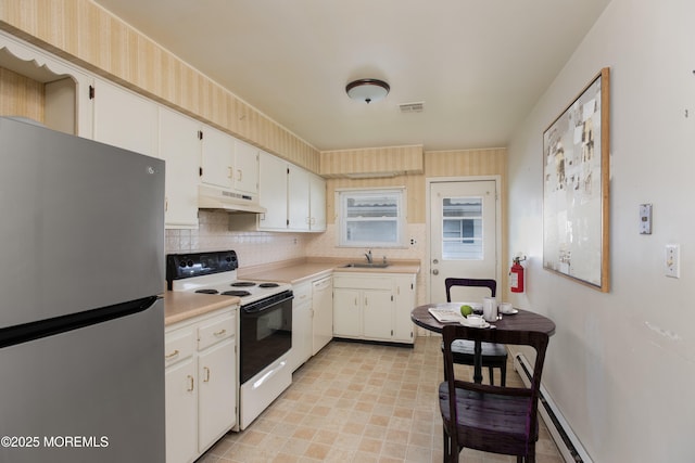 343 Barbados Dr N, Toms River, NJ 08757 - kitchen featuring freestanding refrigerator, electric stove, under cabinet range hood, light countertops, and a sink