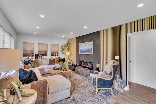 2574 Algonkin Trl, Manasquan, NJ 08736 - living room featuring recessed lighting, wood finished floors, baseboards, and a large fireplace