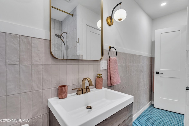 2574 Algonkin Trl, Manasquan, NJ 08736 - bathroom featuring tile walls, vanity, tiled shower, and tile patterned floors
