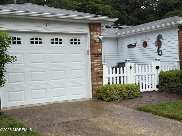 15 Tudor Ct, Brick, NJ 08723 - garage with concrete driveway