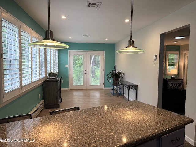 15 Tudor Ct, Brick, NJ 08723 - kitchen with baseboards, french doors, wood finished floors, recessed lighting, and dark stone counters