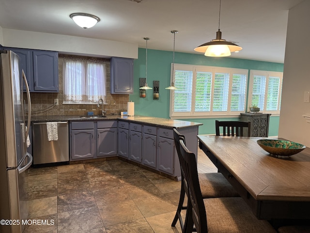 15 Tudor Ct, Brick, NJ 08723 - kitchen with stainless steel appliances, a sink, tasteful backsplash, a peninsula, and gray cabinets
