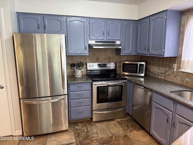 15 Tudor Ct, Brick, NJ 08723 - kitchen featuring stainless steel appliances, under cabinet range hood, backsplash, dark stone finish floors, and blue cabinetry