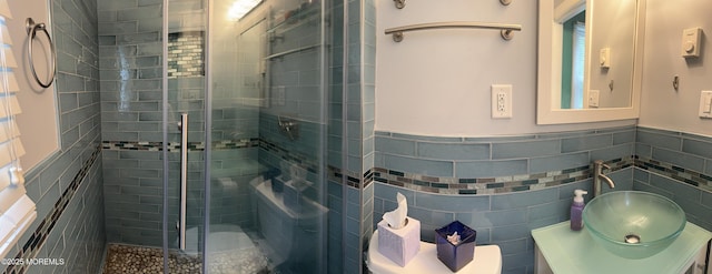 15 Tudor Ct, Brick, NJ 08723 - bathroom with a shower stall, vanity, tile walls, toilet, and wainscoting