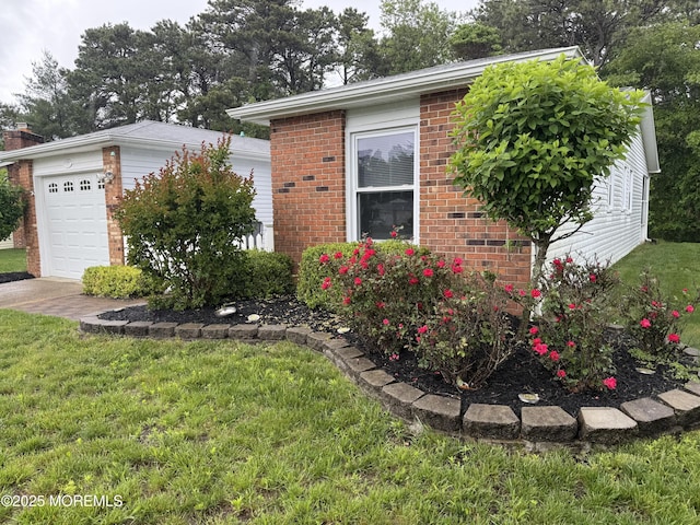 15 Tudor Ct, Brick, NJ 08723 - view of home's exterior with brick siding, a lawn, and a garage