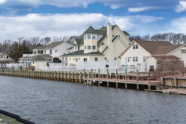 834 Leeward Dr, Forked River, NJ 08731 - rear view of house featuring a chimney, a water view, and a residential view