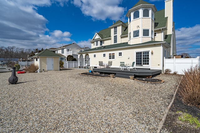 834 Leeward Dr, Forked River, NJ 08731 - back of property with a deck, a residential view, and a chimney