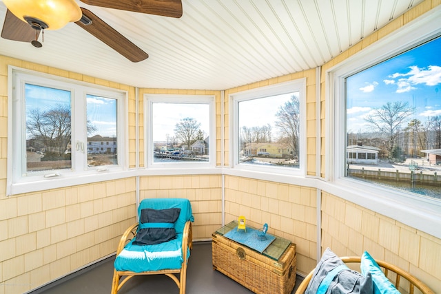 834 Leeward Dr, Forked River, NJ 08731 - sunroom / solarium with ceiling fan, plenty of natural light, finished concrete flooring, and a water view