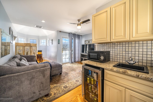 834 Leeward Dr, Forked River, NJ 08731 - living room with beverage cooler, light wood-style flooring, a ceiling fan, recessed lighting, and bar area