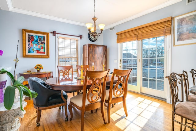 834 Leeward Dr, Forked River, NJ 08731 - dining area featuring plenty of natural light, light wood-style floors, a chandelier, and ornamental molding