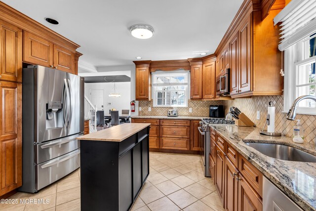 118 New York Ave, Point Pleasant Beach, NJ 08742 - kitchen featuring stainless steel appliances, a sink, backsplash, wooden counters, and brown cabinetry