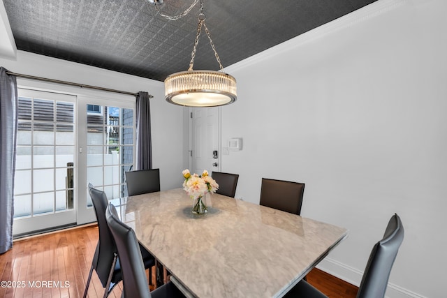 118 New York Ave, Point Pleasant Beach, NJ 08742 - dining space with ornamental molding, wood-type flooring, baseboards, and a chandelier