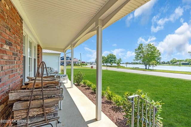 604 N Blvd, Lake Como, NJ 07719 - covered porch with a water view and a yard