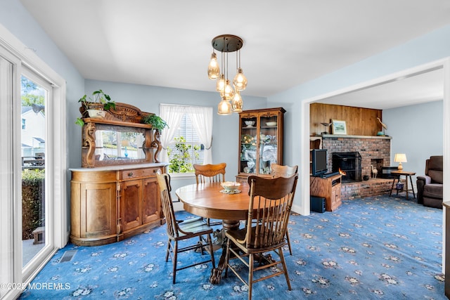 604 N Blvd, Lake Como, NJ 07719 - carpeted dining area with plenty of natural light and a brick fireplace
