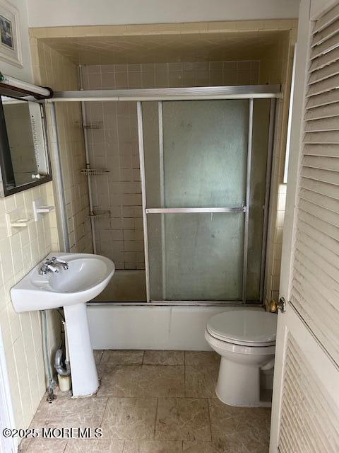 62 Washington St, Red Bank, NJ 07701 - full bathroom with toilet and bath / shower combo with glass door