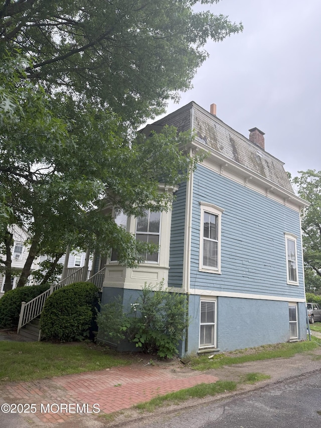 62 Washington St, Red Bank, NJ 07701 - view of home's exterior featuring a chimney