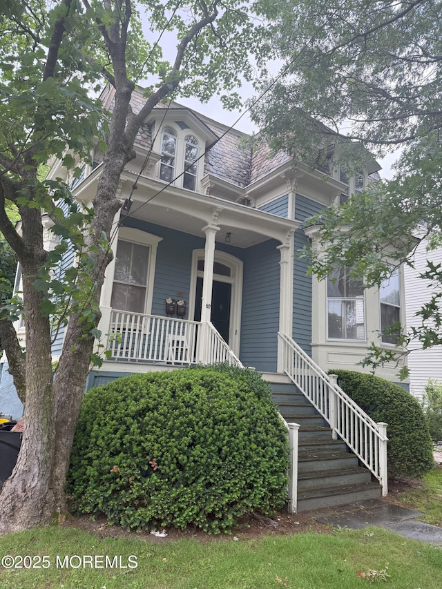 62 Washington St, Red Bank, NJ 07701 - victorian home featuring a porch and stairs