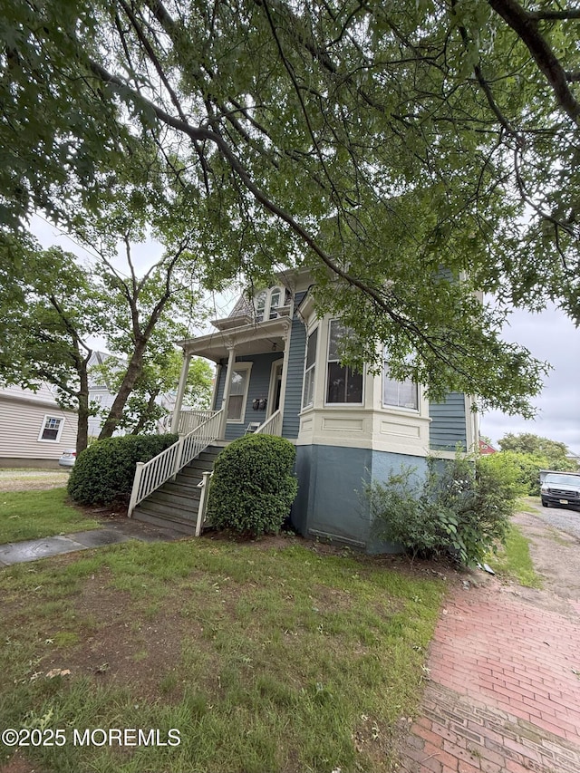 62 Washington St, Red Bank, NJ 07701 - view of front of house with a porch and a front lawn
