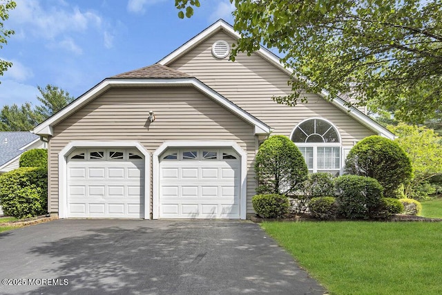 3167 Wood Spring Ln, Toms River, NJ 08755 - view of front of home featuring asphalt driveway, a garage, and a front yard