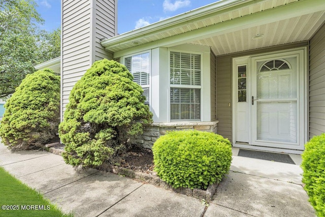 3167 Wood Spring Ln, Toms River, NJ 08755 - property entrance with a chimney