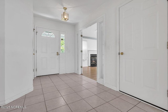 3167 Wood Spring Ln, Toms River, NJ 08755 - foyer entrance with baseboards, light tile patterned floors, and a premium fireplace