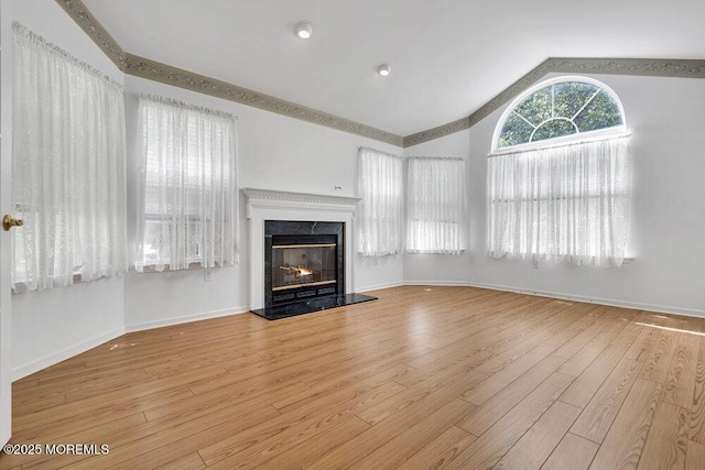 3167 Wood Spring Ln, Toms River, NJ 08755 - unfurnished living room featuring lofted ceiling, a premium fireplace, wood finished floors, and baseboards