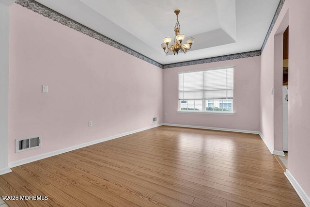 3167 Wood Spring Ln, Toms River, NJ 08755 - empty room with a chandelier, wood finished floors, and baseboards