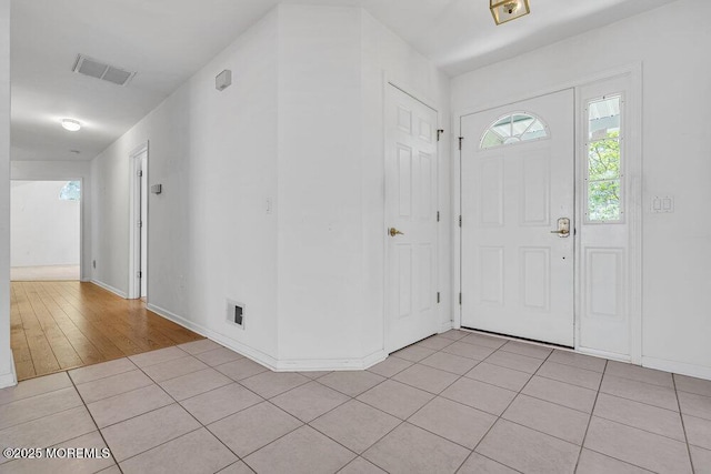 3167 Wood Spring Ln, Toms River, NJ 08755 - foyer featuring light tile patterned floors and baseboards