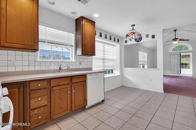 3167 Wood Spring Ln, Toms River, NJ 08755 - kitchen featuring dishwasher, a sink, light countertops, brown cabinetry, and recessed lighting