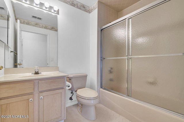 3167 Wood Spring Ln, Toms River, NJ 08755 - bathroom featuring toilet, vanity, tile patterned floors, and enclosed tub / shower combo