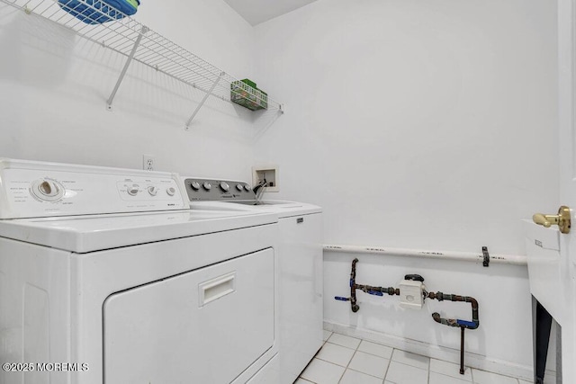3167 Wood Spring Ln, Toms River, NJ 08755 - washroom with washer and clothes dryer, light tile patterned flooring, and baseboards