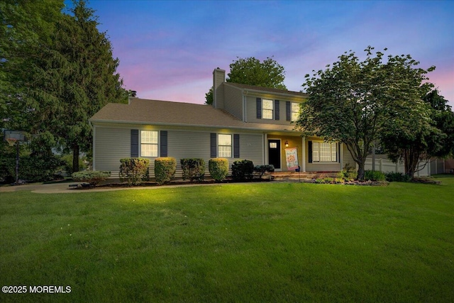 18 Vaughn Dr, Middletown, NJ 07748 - traditional-style home featuring a lawn and a chimney