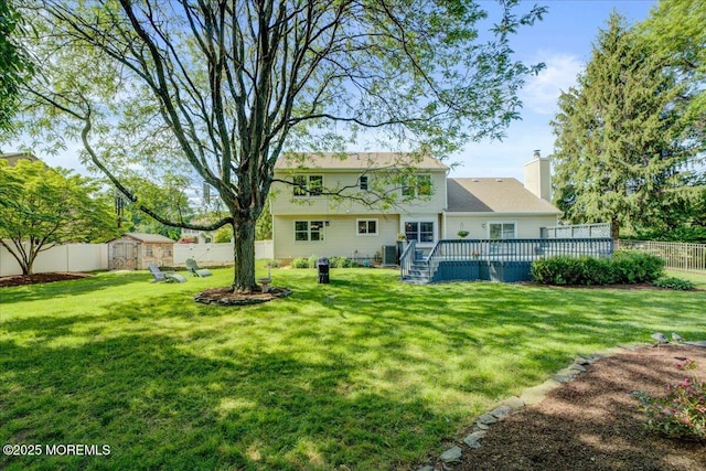 18 Vaughn Dr, Middletown, NJ 07748 - rear view of property featuring a deck and a chimney
