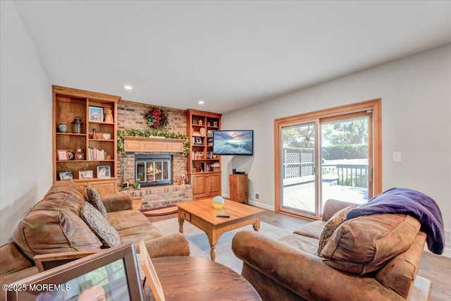 18 Vaughn Dr, Middletown, NJ 07748 - living room with light wood-style flooring, a brick fireplace, recessed lighting, baseboards, and built in shelves