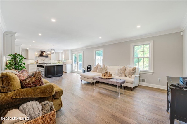 21 Northwoods Rd, Ocean Twp, NJ 07712 - living area with ornamental molding, plenty of natural light, light wood-style floors, baseboards, and recessed lighting
