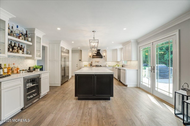 21 Northwoods Rd, Ocean Twp, NJ 07712 - kitchen featuring beverage cooler, stainless steel appliances, french doors, decorative backsplash, and light countertops