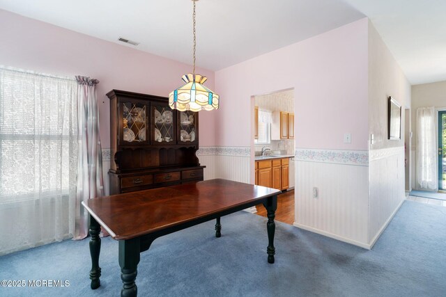 73 Summerhill Dr, Manahawkin, NJ 08050 - carpeted dining room featuring wainscoting and a sink