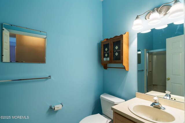 73 Summerhill Dr, Manahawkin, NJ 08050 - full bathroom featuring toilet, vanity, and a shower with shower door