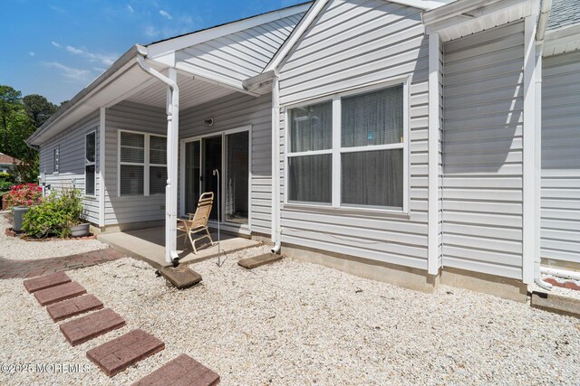73 Summerhill Dr, Manahawkin, NJ 08050 - view of home's exterior featuring a patio and central AC unit