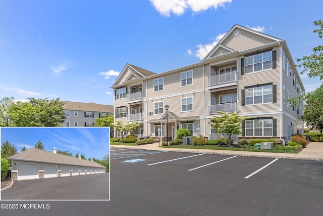 621 Mill Pond Way Unit 103, Eatontown, NJ 07724 - view of building exterior with uncovered parking