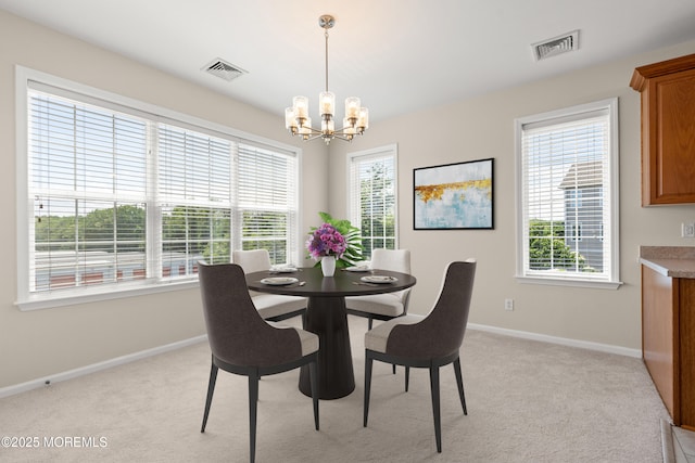 621 Mill Pond Way Unit 103, Eatontown, NJ 07724 - dining space featuring a chandelier, baseboards, and light colored carpet