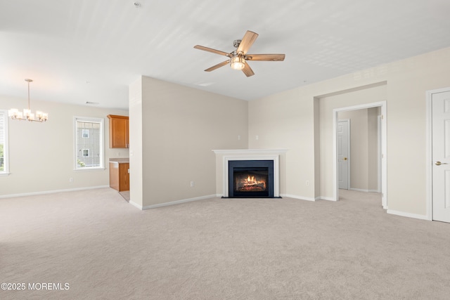 621 Mill Pond Way Unit 103, Eatontown, NJ 07724 - unfurnished living room featuring ceiling fan, a fireplace with flush hearth, light colored carpet, and a chandelier