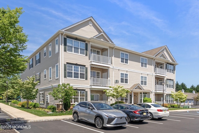621 Mill Pond Way Unit 103, Eatontown, NJ 07724 - view of property featuring uncovered parking