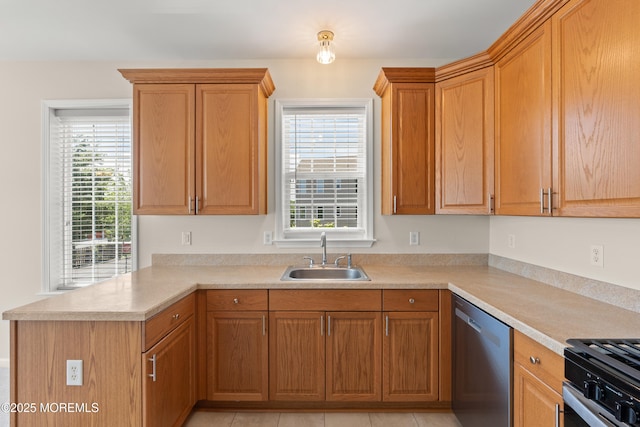 621 Mill Pond Way Unit 103, Eatontown, NJ 07724 - kitchen featuring stainless steel dishwasher, a sink, a peninsula, and healthy amount of natural light