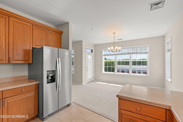 621 Mill Pond Way Unit 103, Eatontown, NJ 07724 - kitchen featuring stainless steel fridge with ice dispenser, light carpet, a chandelier, brown cabinetry, and light countertops