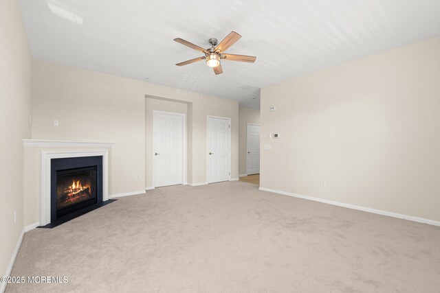 621 Mill Pond Way Unit 103, Eatontown, NJ 07724 - unfurnished living room featuring carpet, a fireplace with flush hearth, a ceiling fan, and baseboards