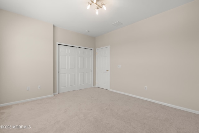 621 Mill Pond Way Unit 103, Eatontown, NJ 07724 - unfurnished bedroom with light carpet, a closet, and baseboards
