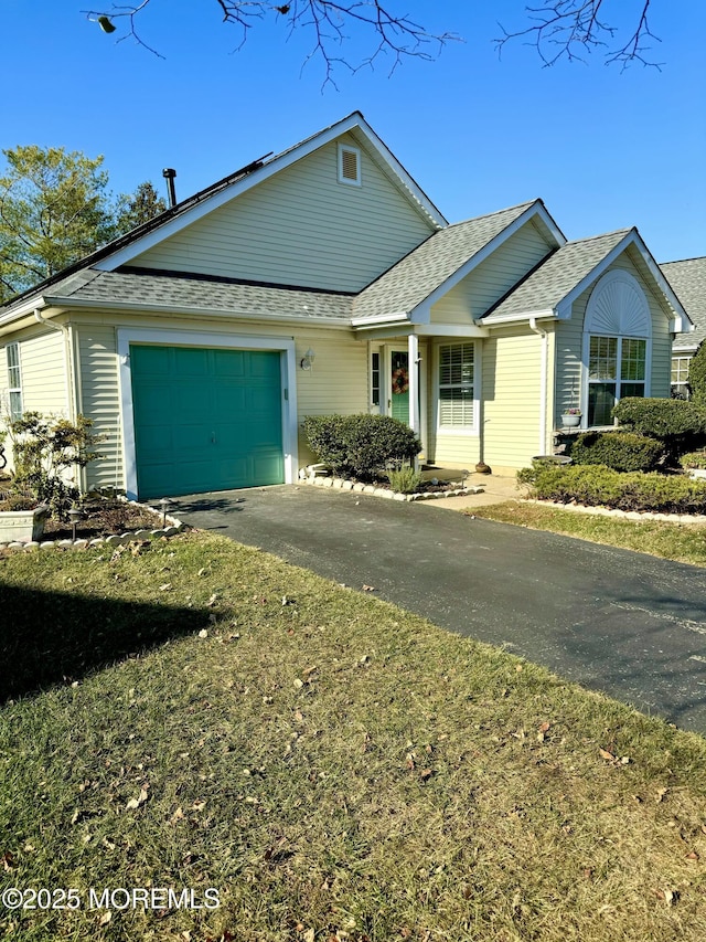 2560 Haverhill Ct, Toms River, NJ 08755 - ranch-style home featuring an attached garage, driveway, and roof with shingles