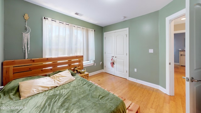 545 Hopedale Dr SW, Berkeley, NJ 08721 - bedroom featuring light wood-style floors, baseboards, and a closet